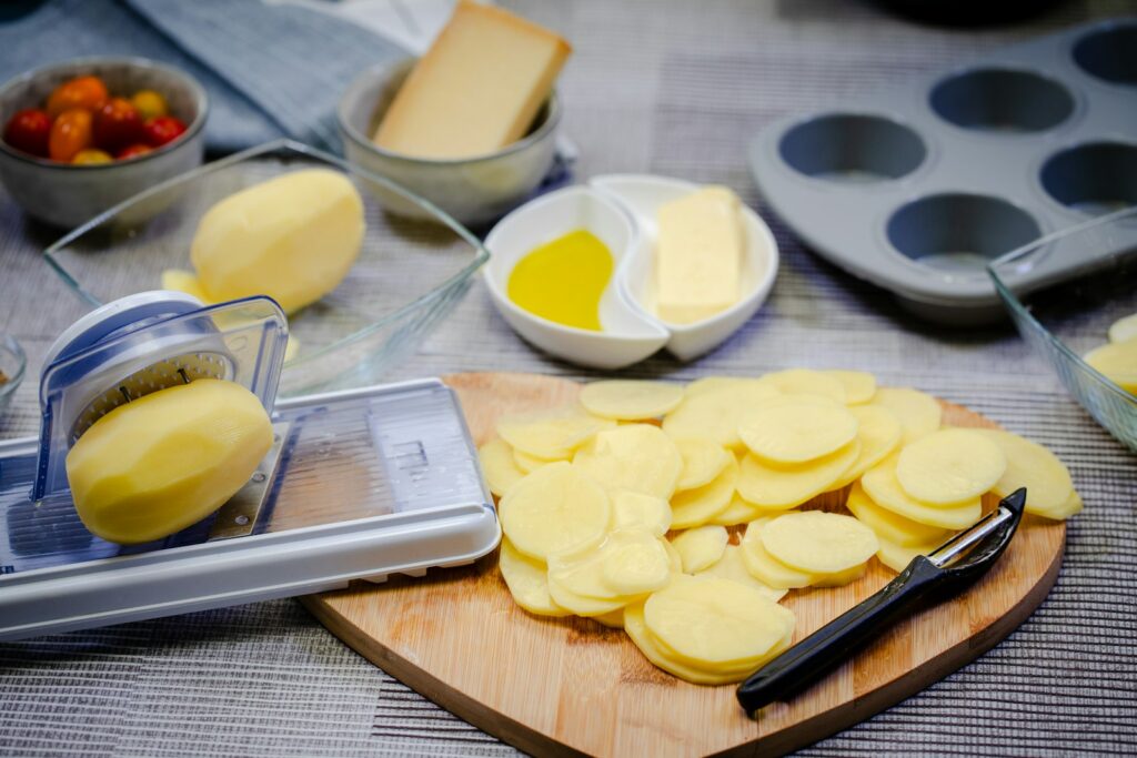 Slicing potatoes on a mandoline