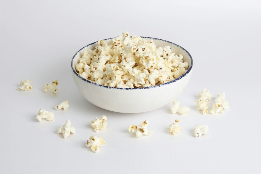 A white bowl of plain popcorn