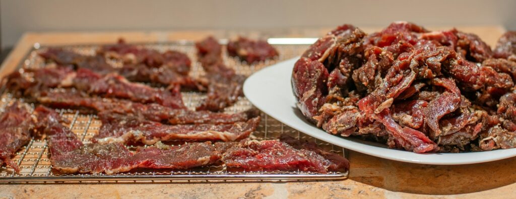 Strips of beef jerky on trays