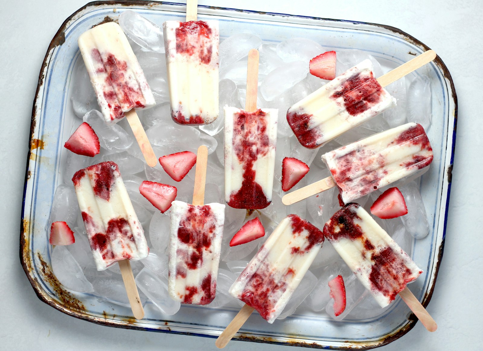 Creamy berry popsicles on ice